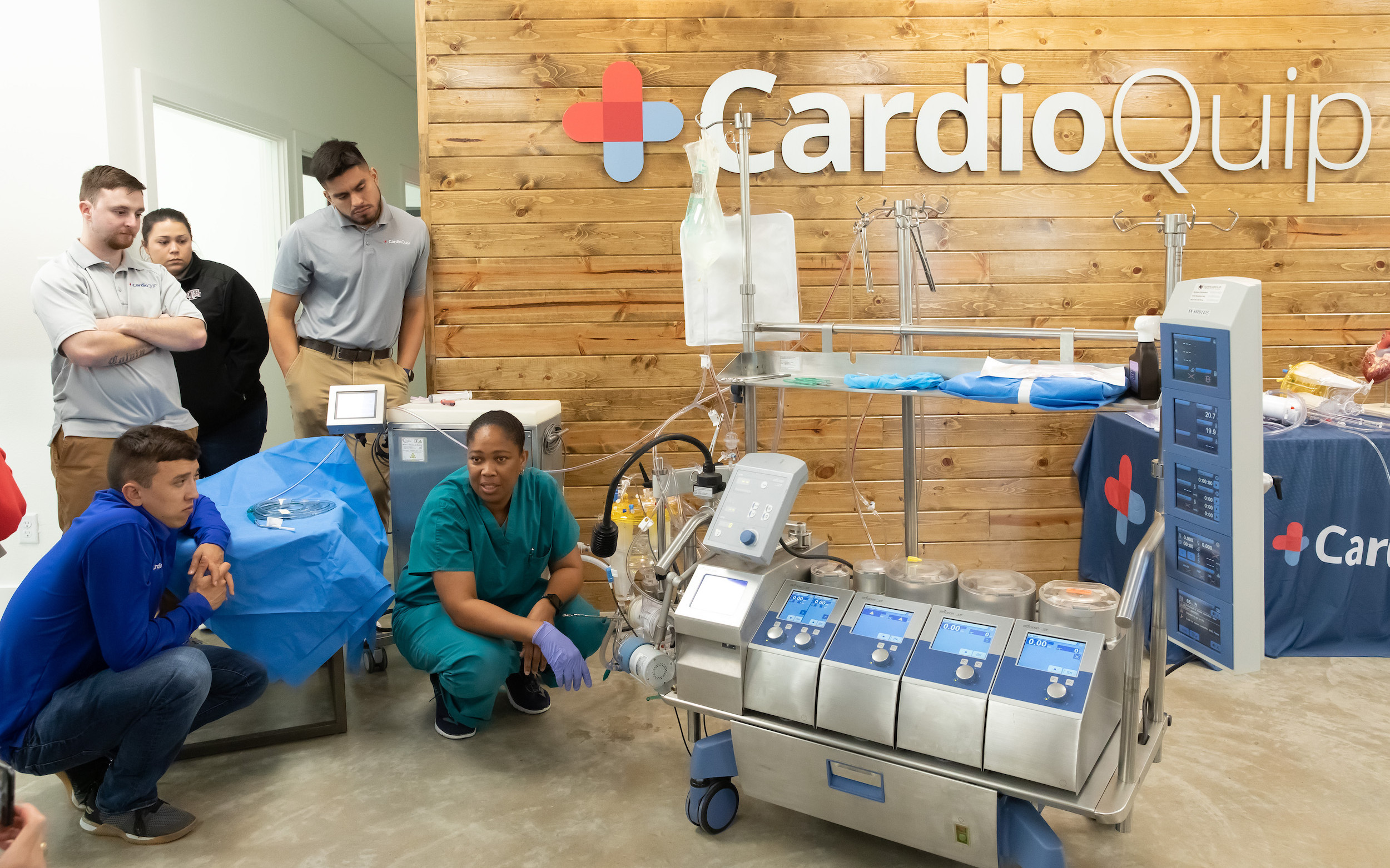 CardioQuip employee showing how their machine works